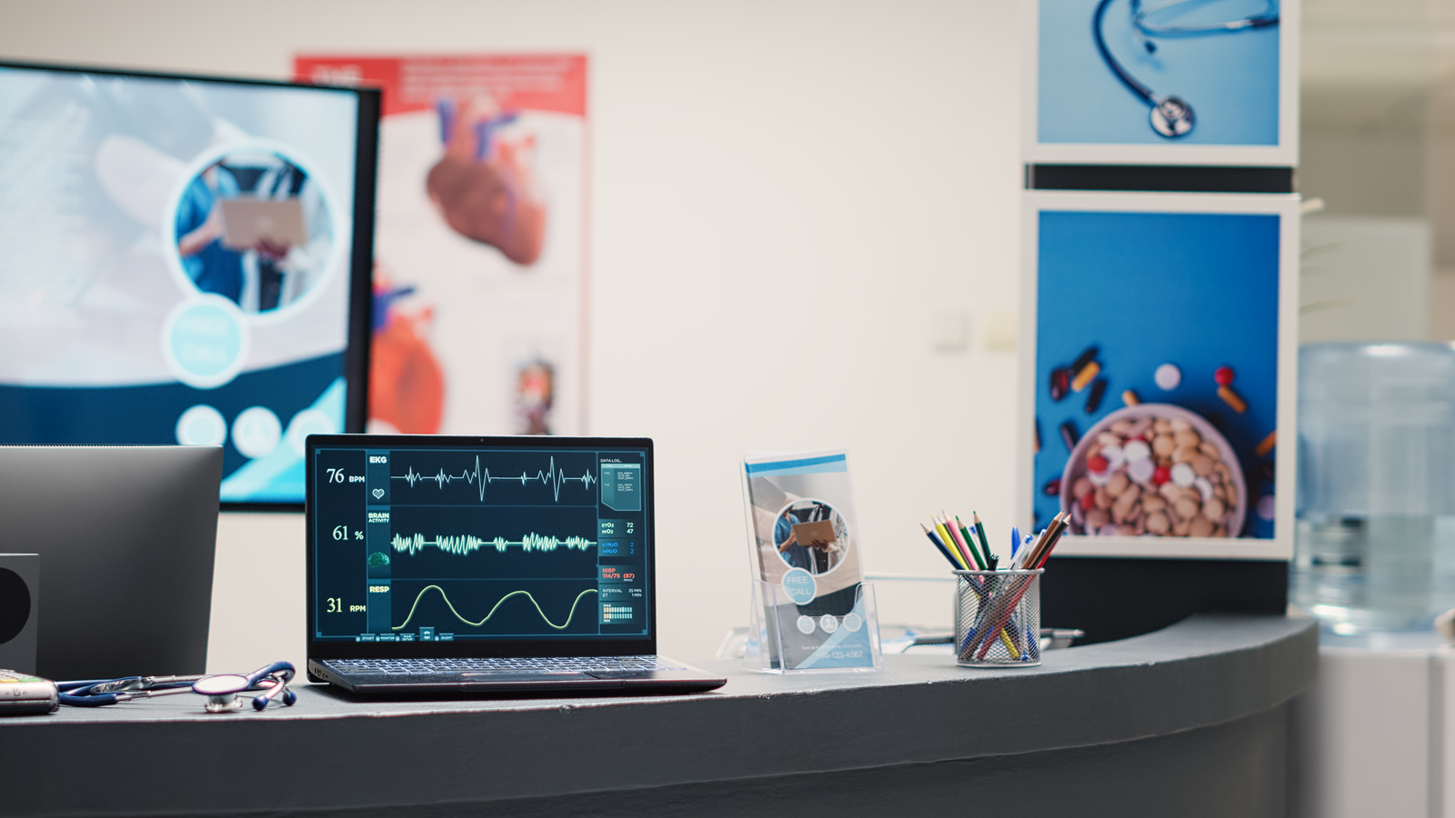 Illustration of a laptop displaying cardiogram and heart-rate traces on a desk in an empty medical facility lobby.